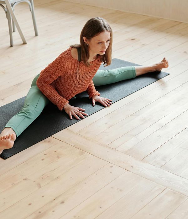 Person practicing gentle movement in a calm indoor environment